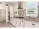 Kitchen boasts granite countertops and gas cooktop at 18346 W Coolidge St, Goodyear, AZ 85395
