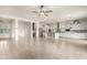 Open concept kitchen with white cabinets, large island, and stainless steel appliances at 18346 W Coolidge St, Goodyear, AZ 85395
