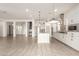 Modern kitchen with island, stainless steel appliances, and open floor plan at 18346 W Coolidge St, Goodyear, AZ 85395
