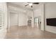 Open living space with tile floors and views into kitchen and backyard at 18346 W Coolidge St, Goodyear, AZ 85395