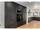 Modern kitchen with dark cabinetry and stainless steel appliances at 1841 N 16Th Ave, Phoenix, AZ 85007