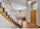 Elegant entryway with a curved staircase, wood railing, and tile flooring at 1882 W Canary Way, Chandler, AZ 85286