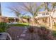 Landscaped backyard with artificial turf and patio at 2004 E Brigadier Dr, Gilbert, AZ 85298