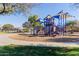 Community playground with playset and swings at 2004 E Brigadier Dr, Gilbert, AZ 85298