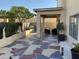 Covered patio and landscaped backyard with decorative statues at 2049 N Arbor Ln, Chandler, AZ 85225