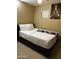 Cozy bedroom with a full-size bed and Eiffel Tower art at 2049 N Arbor Ln, Chandler, AZ 85225