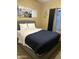 Spacious bedroom with a queen bed and large window at 2049 N Arbor Ln, Chandler, AZ 85225