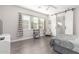Comfortable bedroom with wood flooring and barn door at 20771 W Windsor Blvd, Buckeye, AZ 85396