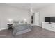 Bedroom with a queen bed and built in shelving at 20771 W Windsor Blvd, Buckeye, AZ 85396