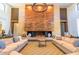 Spacious community lounge with a large fireplace and comfortable seating at 20771 W Windsor Blvd, Buckeye, AZ 85396
