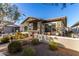 House exterior view with walkway, landscaping and neighboring houses visible at 20771 W Windsor Blvd, Buckeye, AZ 85396