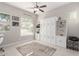 Bright home office with built-in shelving and window coverings at 20771 W Windsor Blvd, Buckeye, AZ 85396