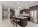 Open concept kitchen with island and stainless steel appliances at 20771 W Windsor Blvd, Buckeye, AZ 85396