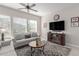 Spacious living room with a cozy seating arrangement and fireplace at 20771 W Windsor Blvd, Buckeye, AZ 85396