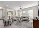 Bright living room features comfortable seating and large windows at 20771 W Windsor Blvd, Buckeye, AZ 85396