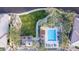 Community pool with lounge chairs and shaded areas at 20771 W Windsor Blvd, Buckeye, AZ 85396