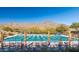 Inviting community pool with mountain views and lounge chairs at 20771 W Windsor Blvd, Buckeye, AZ 85396