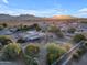 Aerial view of house, expansive backyard, and surrounding landscape at 20918 E Orchard Ln, Queen Creek, AZ 85142