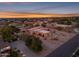 An aerial shot showcasing a stunning property, complete with a large yard and desert landscaping at 20918 E Orchard Ln, Queen Creek, AZ 85142