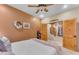 Bedroom with wooden doors and carpet flooring at 20918 E Orchard Ln, Queen Creek, AZ 85142