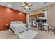 Bedroom with king bed, access to patio, and workspace at 20918 E Orchard Ln, Queen Creek, AZ 85142