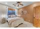 Bedroom with queen bed and ceiling fan at 20918 E Orchard Ln, Queen Creek, AZ 85142