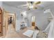 Bedroom with built-in desk and access to another room at 20918 E Orchard Ln, Queen Creek, AZ 85142