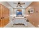 Bedroom with queen bed and ceiling fan at 20918 E Orchard Ln, Queen Creek, AZ 85142