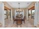 Bright dining room with wood table and chandelier at 20918 E Orchard Ln, Queen Creek, AZ 85142