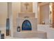 Elegant fireplace with a curved hearth and decorative mantle at 20918 E Orchard Ln, Queen Creek, AZ 85142