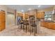 Kitchen with granite countertops, wood cabinets, and an island at 20918 E Orchard Ln, Queen Creek, AZ 85142