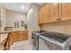 Laundry room with washer, dryer, and built-in cabinets at 20918 E Orchard Ln, Queen Creek, AZ 85142