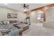 Living area with sectional sofa and view to bedroom at 20918 E Orchard Ln, Queen Creek, AZ 85142