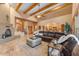 Living room with a cozy fireplace and views into kitchen area at 20918 E Orchard Ln, Queen Creek, AZ 85142