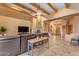 Open living room featuring a fireplace and access to other rooms at 20918 E Orchard Ln, Queen Creek, AZ 85142