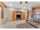 Living area with sectional sofa and built-in entertainment center at 20918 E Orchard Ln, Queen Creek, AZ 85142