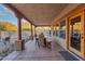 Covered patio with seating area, perfect for outdoor dining and relaxation at 20918 E Orchard Ln, Queen Creek, AZ 85142