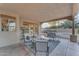 Covered patio furnished with comfortable seating and a coffee table at 20918 E Orchard Ln, Queen Creek, AZ 85142