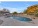 Inviting kidney-shaped pool with water features in the backyard at 20918 E Orchard Ln, Queen Creek, AZ 85142