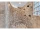 Large walk-in shower with dual shower heads and tiled seating at 20918 E Orchard Ln, Queen Creek, AZ 85142