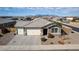 Single-story home with three-car garage and attractive landscaping at 22230 N Daniel Dr, Maricopa, AZ 85138