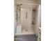 Clean bathroom featuring a walk-in shower and grab bars at 2233 E Behrend Dr # 197, Phoenix, AZ 85024