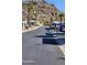 Street view of mobile home community nestled against a mountain backdrop at 2233 E Behrend Dr # 197, Phoenix, AZ 85024