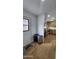 Bright entryway with wood flooring and view into kitchen at 2233 E Behrend Dr # 197, Phoenix, AZ 85024