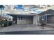 Tan mobile home with carport and desert landscaping at 2233 E Behrend Dr # 197, Phoenix, AZ 85024