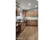 Kitchen with wood cabinets and a built in desk area at 2233 E Behrend Dr # 197, Phoenix, AZ 85024