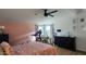 Main bedroom with a ceiling fan, large window, and walk-in closet at 2233 E Behrend Dr # 197, Phoenix, AZ 85024