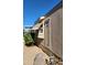 Side view of mobile home showing window and door at 2233 E Behrend Dr # 197, Phoenix, AZ 85024