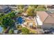 Backyard with pool, spa, playset, and outdoor kitchen at 2415 W Desperado Way, Phoenix, AZ 85085