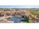 Two-story house with a three-car garage and landscaped yard at 2415 W Desperado Way, Phoenix, AZ 85085